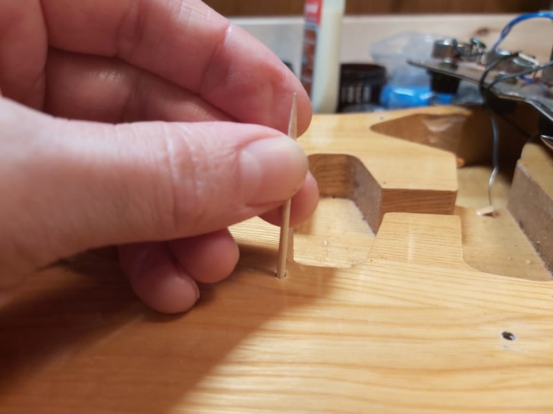 fixing a stripped pickguard screwhole